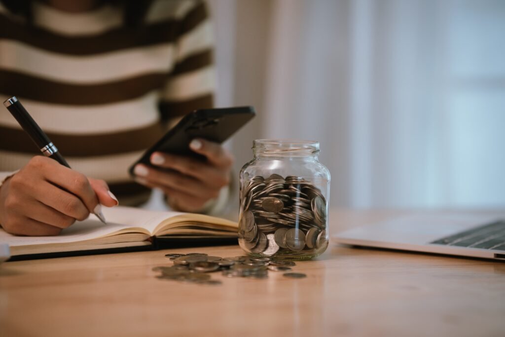 a,woman,holds,a,piggy,bank,,which,symbolizes,savings,,financial